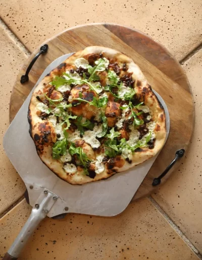 Caramelised Muntries Pizza with Goats Cheese, Onion and Pepperleaf Oil